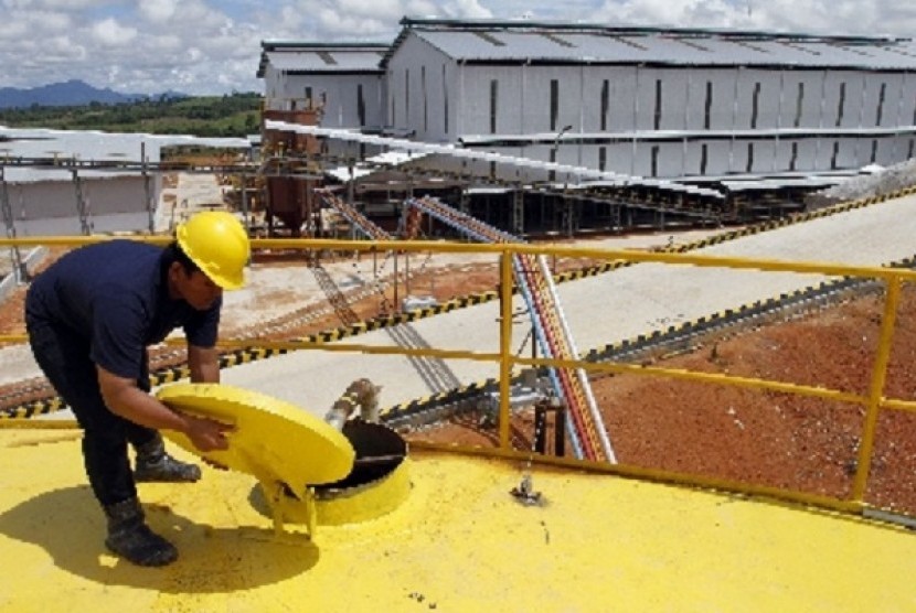 A worker checks the main storage tank of CPO of PT Dharma Satya Nusantara (DSN) in Lamandau, Central Kalimantan.