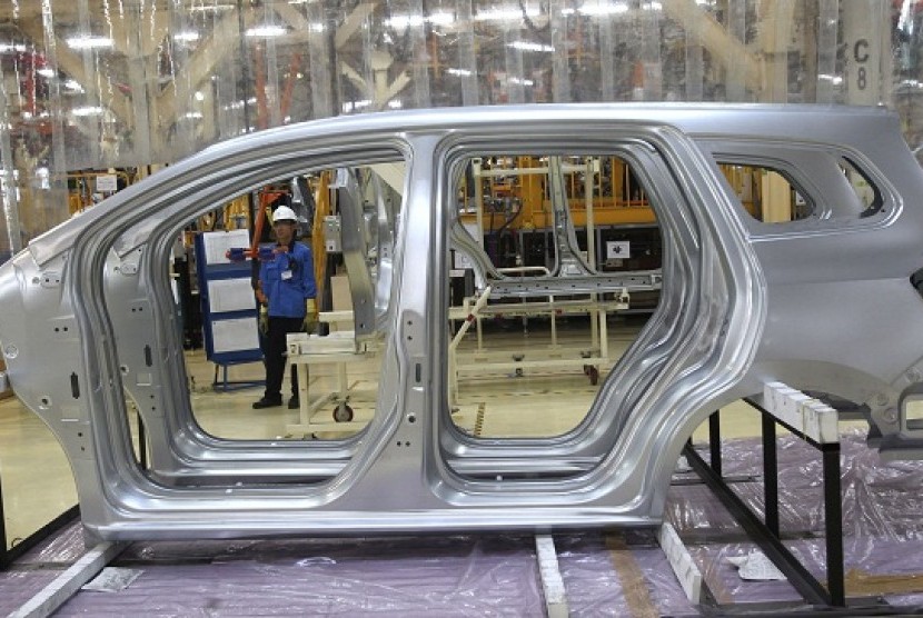 A worker is seen through the frames of car in manufacturing facility in Bekasi, West Java, Indonesia. (illustration)