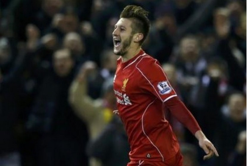 Adam Lallana melakukan selebrasi stelah menjebol gawang Swansea City, Selasa (29/12) WIB.