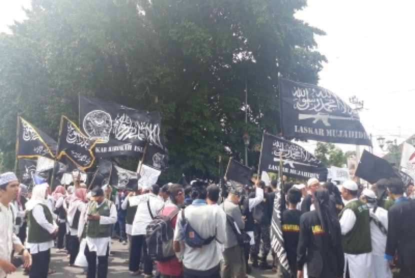 Aksi solidaritas untuk Muslim Uighur yang digelar di Titik Nol  Kilometer Yogyakarta, Jumat (21/12).