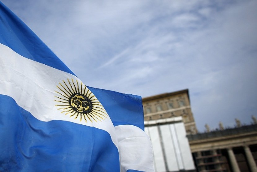 An Argentine national flag flutters in the wind, in front of the future private apartment of Pope Francis at the Vatican on March 17, 2013. 