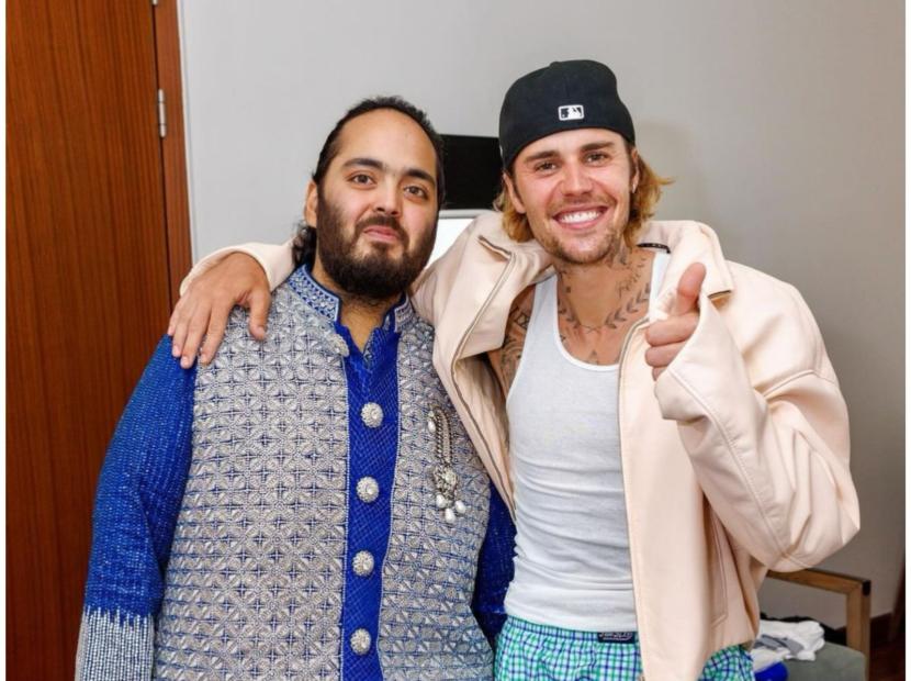 Anant Ambani (kiri) dan Justin Bieber (kanan). Justin Bieber dikabarkan mendapat bayaran Rp 162 miliar saat tampil di rangkaian acara pernikahan Anant Ambani dan Radhika Merchant.