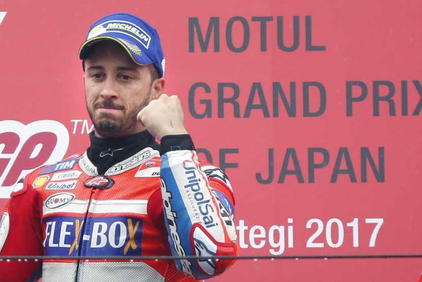 Andrea Dovizioso meraih podium juara di GP Jepang, Ahad (15/10).