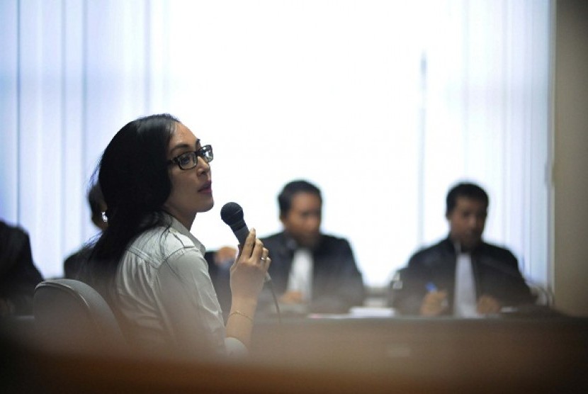 Angelina Sondakh attends her first trial at Anti-corruption Court in Jakarta on Thursday.  