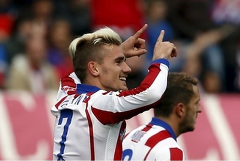 Antoine Griezmann merayakan golnya ke gawang Elche.