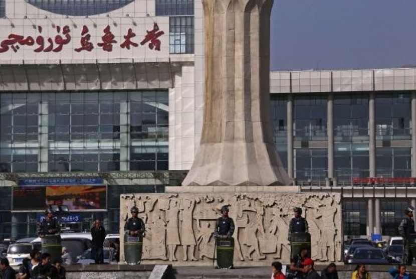 Armed police guard at the entrance of the South Railway Station, where three people were killed and 79 wounded in April's bomb and knife attack, in Urumqi, Xinjiang Uighur Autonomous region, May 2, 2014.