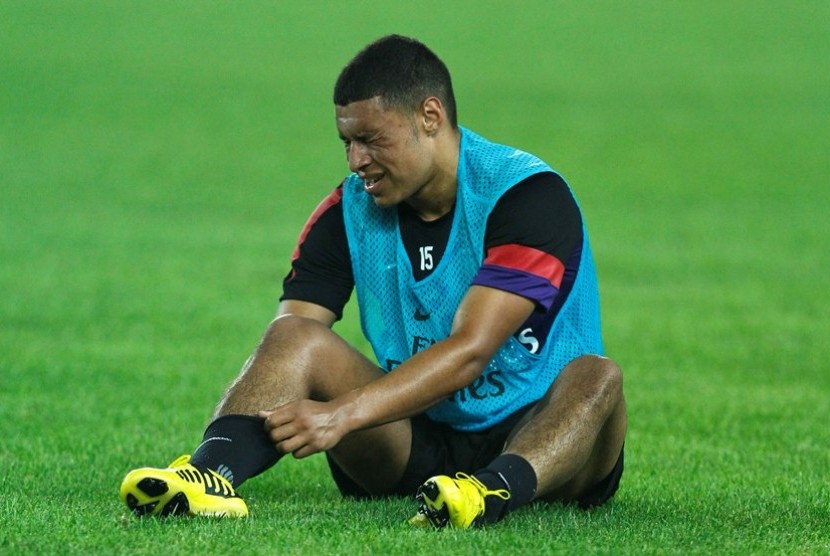 Arsenal's Alex Oxlade-Chamberlain rests during a training session in Beijing, China, Thursday, July 26, 2012. Arsenal will play Manchester City at China's National Stadium, also known as the 
