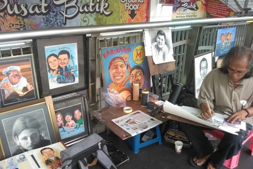 Bagong, pelukis di Pelataran Blok M Square, Jakarta Selatan