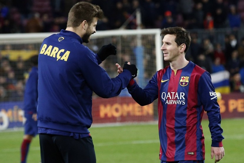Gerard Pique dan Lionel Messi (kanan) saat masih sama-sama membela Barcelona.