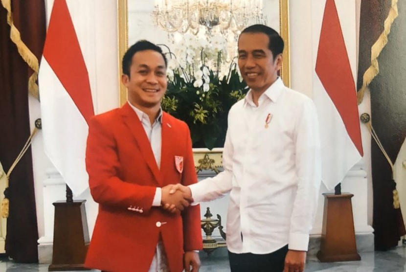 Bendahara Umum PKPI Iwan Bogananta (kiri) bersama Presiden Joko Widodo.