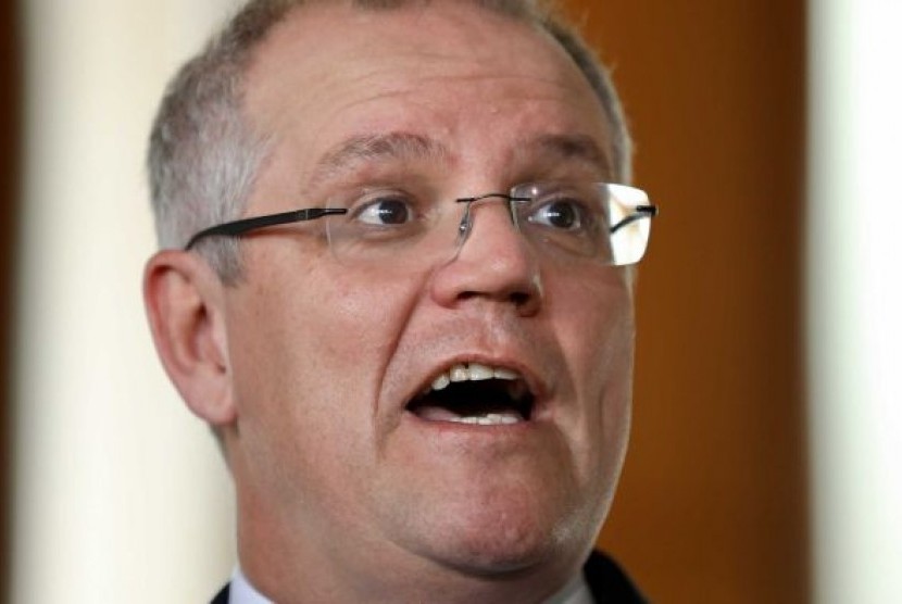 Bendahara Utama Australia Scott Morrison berbicara kepada media mengenai pajak backpacker.