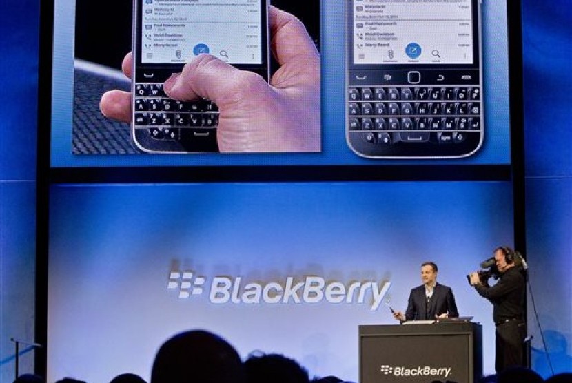 BlackBerry's director of marketing and enterprise Jeff Gadway demonstrates the company's new phone the BlackBerry Classic, during a news conference, Wednesday, Dec. 17, 2014, in New York. 