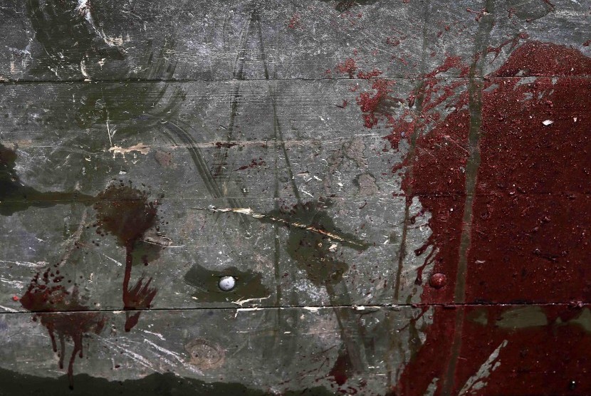 Blood stains are seen on a wrecked rebel truck in a Donetsk neighborhood May 27, 2014.