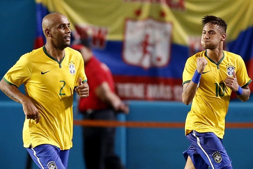  Brazil striker Neymar Junior celebrates his game winning goal with Maicon (2) against Columbia n the second half at Sun Life Stadium. Brazil won 1-0.