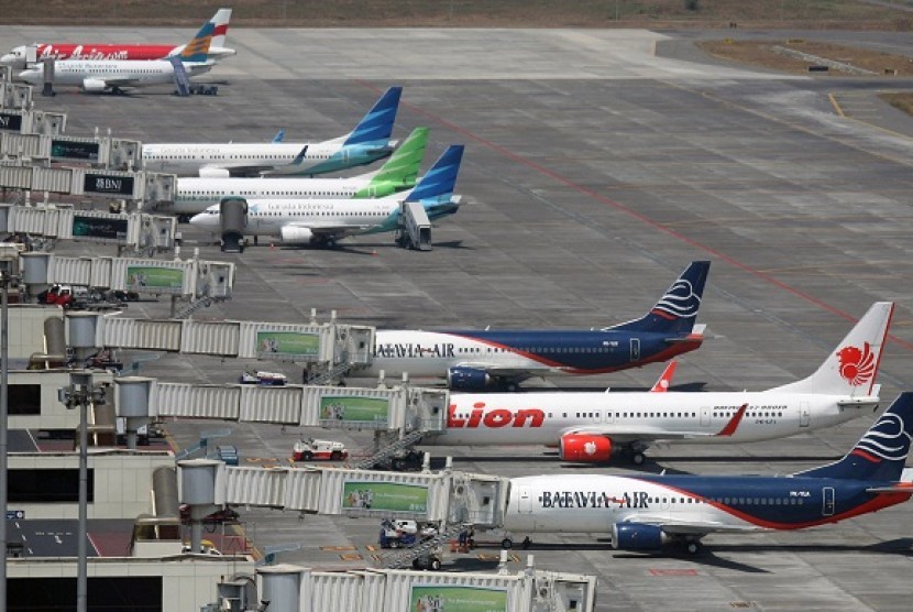 Budget airlines' passenger jets are seen parked on the tarmac at Juanda International Airport in Surabaya, East Java, Indonesia. Two Indonesian airlines, Mandala Airlines and Lion Air, are competing with 20 other low cost airlines to target Thailand's mark