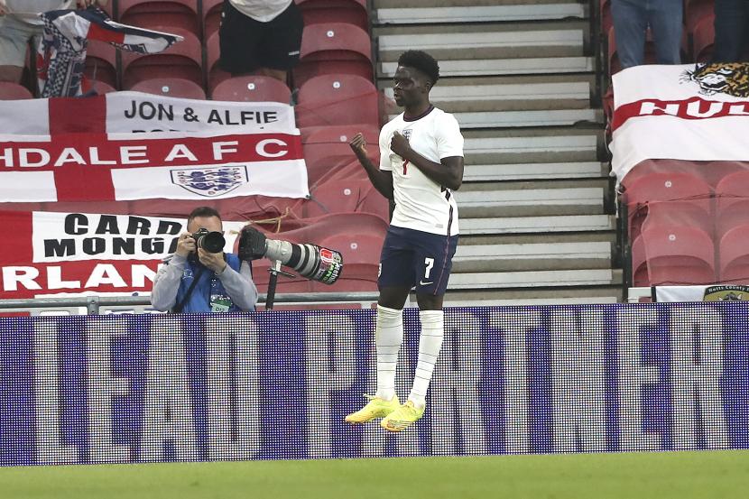 Bukayo Saka dari timnas Inggris merayakan golnya ke gawang Austria pada pertandingan persahabatan internasional antara Inggris dan Austria di Stadion Riverside di Middlesbrough, Inggris, Rabu 2 Juni 2021.