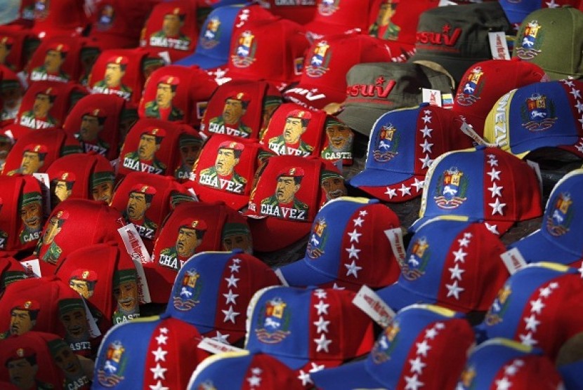 Caps bearing the image of the late President Hugo Chavez are picture for sale outside of the Military Academy, where the funeral service of Chavez is being held, in Caracas on March 9.