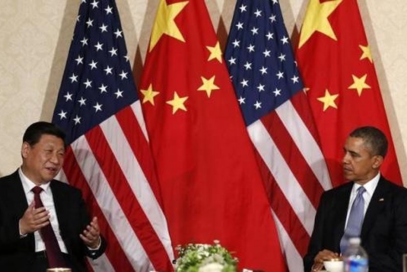 China's President Xi Jinping speaks during his meeting with U.S. President Barack Obama (R), on the sidelines of a nuclear security summit, in The Hague March 24 2014.