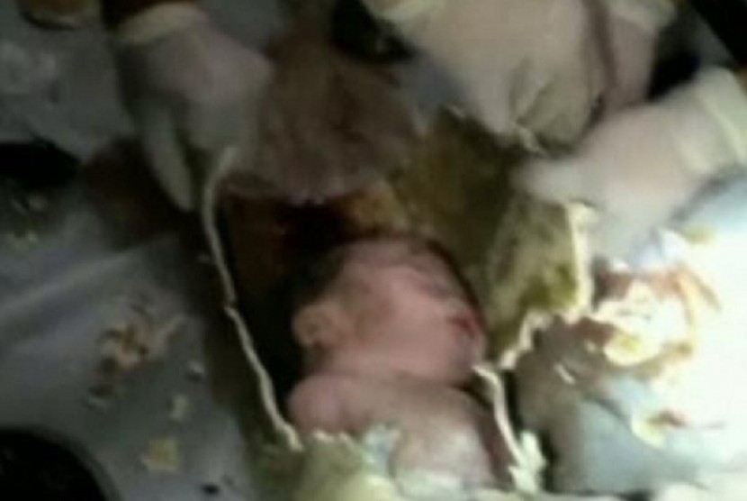 Chinese state media say firefighters and medics rescued a newborn baby boy from a sewer pipe beneath a squat toilet.