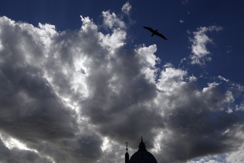 Clouds are seen over the Saint Peter's Basilica at the Vatican March 9, 2013. (illustration)