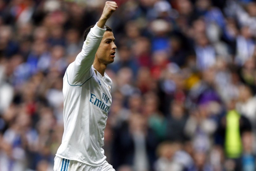 Cristiano Ronaldo merayakan gol ke gawang Sevilla pada laga Liga Liga, Sabtu (9/12).