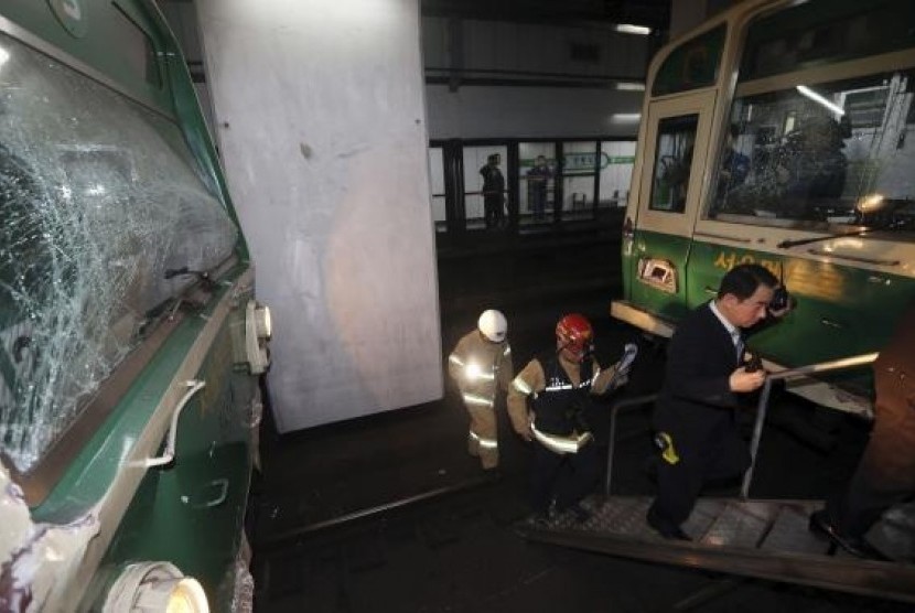 Damaged subway trains are seen at a subway station in Seoul May 2, 2014.