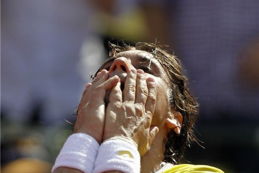 David Ferrer, petenis asal Spanyol, meluapkan emosinya usai mengalahkan petenis Swiss, Stanislas Wawrinka, di turnamen Buenos Aires Terbuka di Buenos Aires Lawn Tennis Club, Argentina, Ahad (24/2). 