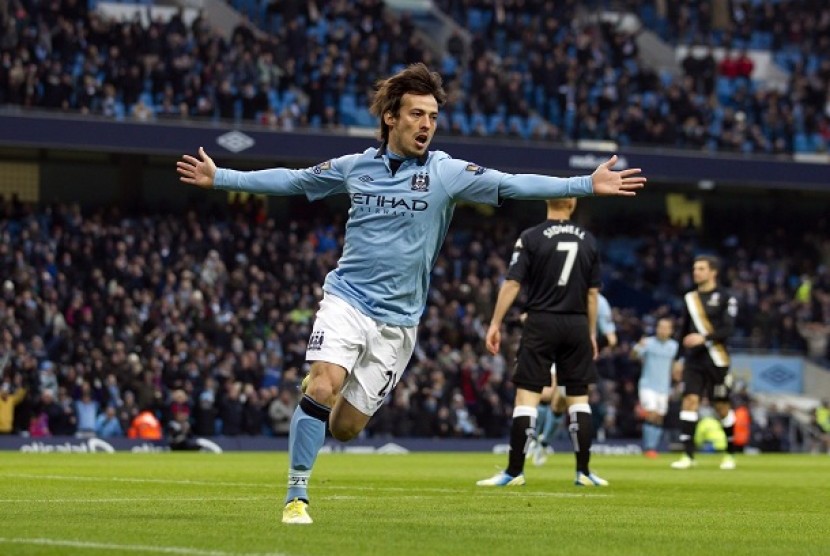   David Silva meluapkan kegembiraan usai menceploskan bola ke gawang Fulham dalam pertandingan lanjutan English Premier League, Sabtu (19/1/2013) di Etihad Stadium. 