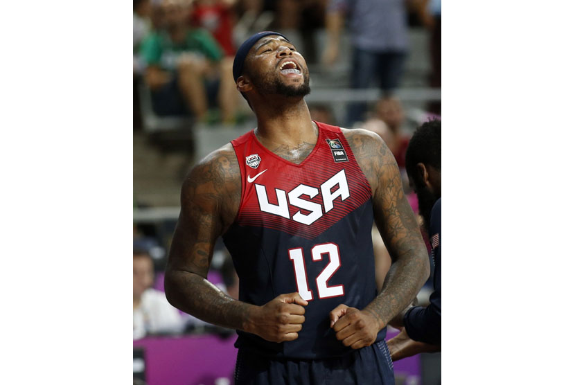 DeMarcus Cousins of the U.S. celebrates his team's victory over Slovenia at the end of their Basketball World Cup quarter-final game in Barcelona September 9, 2014.