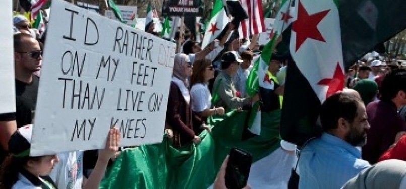Demonstrasi warga Amerika di Washington memperingati satu tahun perlawanan Rakyat Suriah terhadap rezim Bashar al Assad
