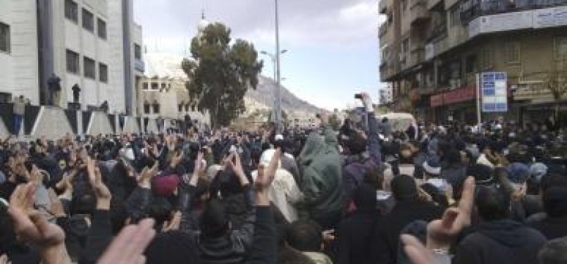 Demonstrators protest against Syria's President Bashar al-Assad in Damascus, last weekend. 