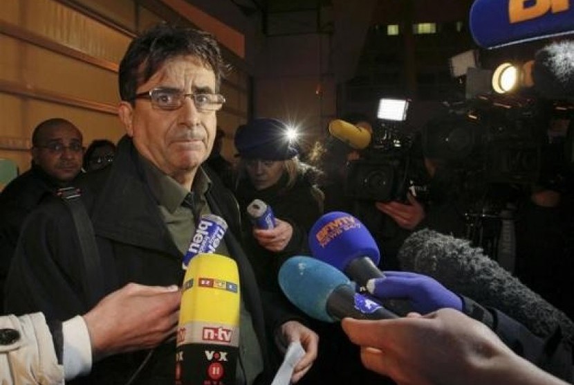 Deputy director Jean Marc Grenier talks to media outside the CHU Nord hospital in Grenoble, French Alps, where retired seven-times Formula One world champion Michael Schumacher is hospitalized after a ski accident, December 29, 2013.