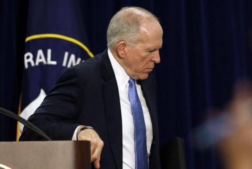 Director of the Central Intelligence Agency (CIA) John Brennan walks away after holding a rare news conference at CIA Headquarters in Virginia, December 11, 2014.