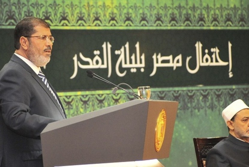 Egypt's President Mohamed Mursi speaks during the Laylat al-Qadr at Egypt Al-Azhar Conference Center at Nasr City in Cairo August 12, 2012. Egypt's new, civilian president dismissed Cairo's two top generals on Sunday and quashed a military order that had c