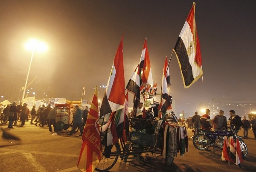 Egyptian flags are displayed for sale during New Year's Eve celebrations at Tahrir Square, in Cairo December 31, 2012. 