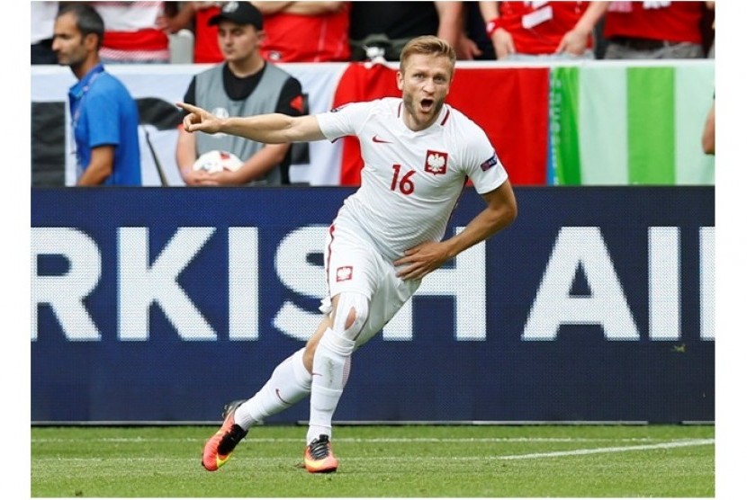 Ekspresi gelandang Polandia Jakub Blaszczykowski usai membobol gawang Swiss.