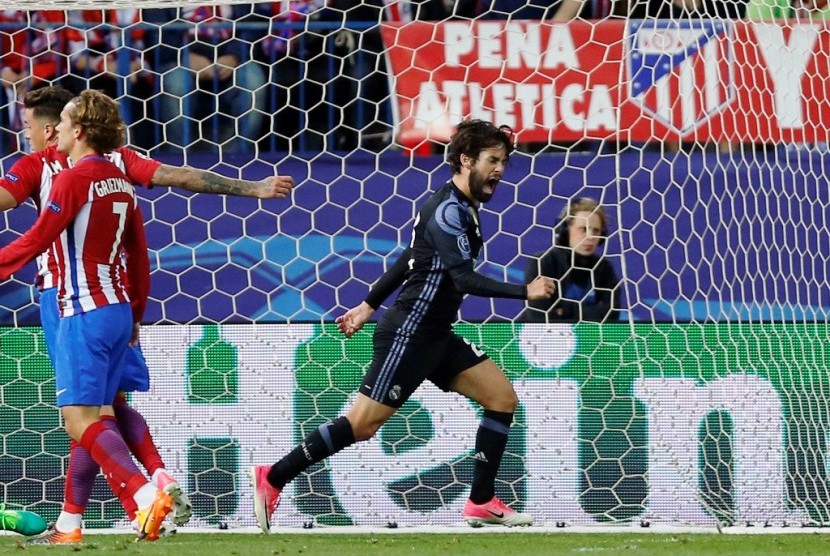 Ekspresi Isco (kanan) seusai membobol gawang Atletico Madrid.