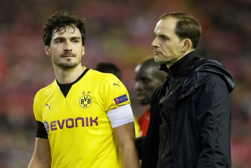 Ekspresi kekecewaan Matt Hummels (kiri) usai timnya Borussia Dortmund disingkirkan Liverpool.