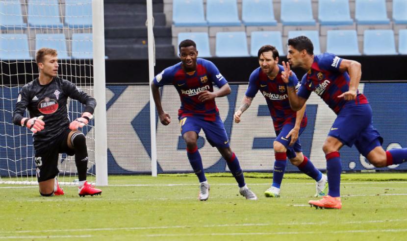 Ekspresi Luis Suarez (kanan) seusai mencetak gol untuk Barcelona.