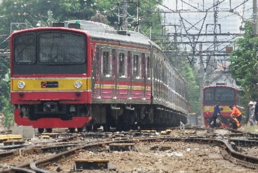 Electric train services (KRL) Commuter Line passing Manggarai Station, Jakarta.