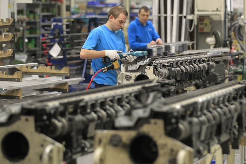 Employees at Belgian company Picanol works on the construction of weaving machines at the factory's plant in Ypres. Picanol, a leading exporter of the weaving machines, is reliant on countries outside Europe for its growth as Belgium and the euro zone stru