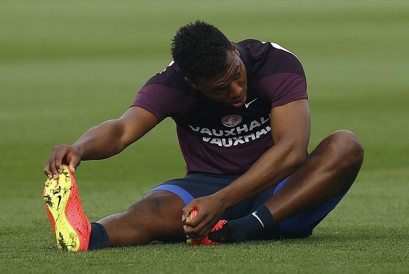 England's Daniel Sturridge stretches during a training session at the St George's Park training complex near Burton-upon-Trent, central England, September 5, 2014