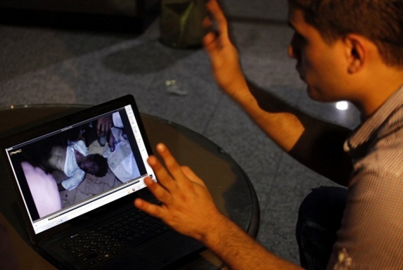  Fahd al-Bakoush, a freelance videographer, 22, shows a video he took of the body of U.S. Ambassador Chris Stevens being carried out of a small dark room in the U.S. consulate in Benghazi, during an interview with the Associated Press, in Benghazi, Libya, 