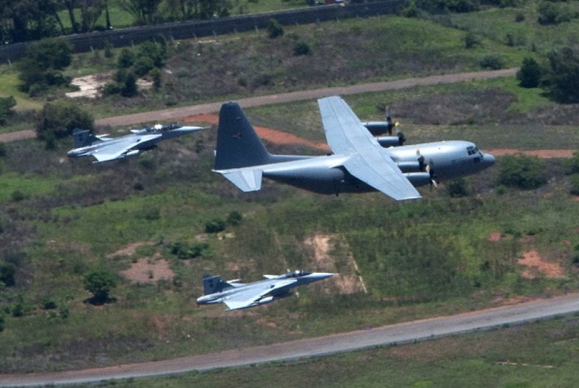 Fighter jets escort the military plane carrying the coffin of former South African President Nelson Mandela as it is flown to Mandela's home in the village of Qunu, Eastern Cape in this December 14, 2013 handout picture provided by the South African Govern