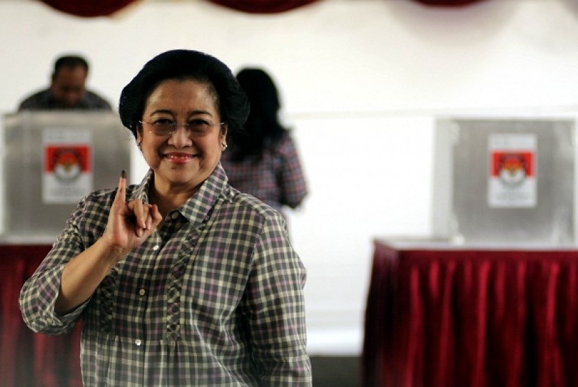Former president Megawati votes during local elections to choose governor of Jakarta, recently.   
