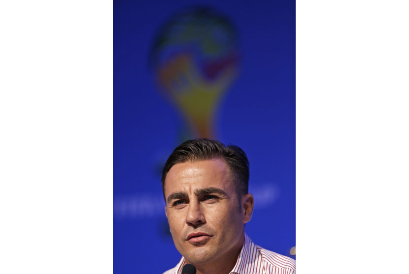 Former soccer great and World Cup winner Fabio Cannavaro of Italy answers a question during a press conference one day before the draw for the 2014 soccer World Cup in Costa do Sauipe near Salvador, Brazil, Thursday, Dec. 5, 2013.