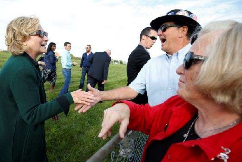 Former US Secretary of State Hillary Clinton greets supporters at the 37th Harkin Steak Fry in Indianola, Iowa September 14, 2014.