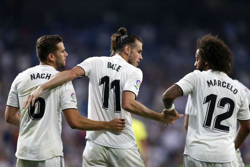 Gareth Bale (tengah) diapit Marcelo (kanan) dan Nacho.