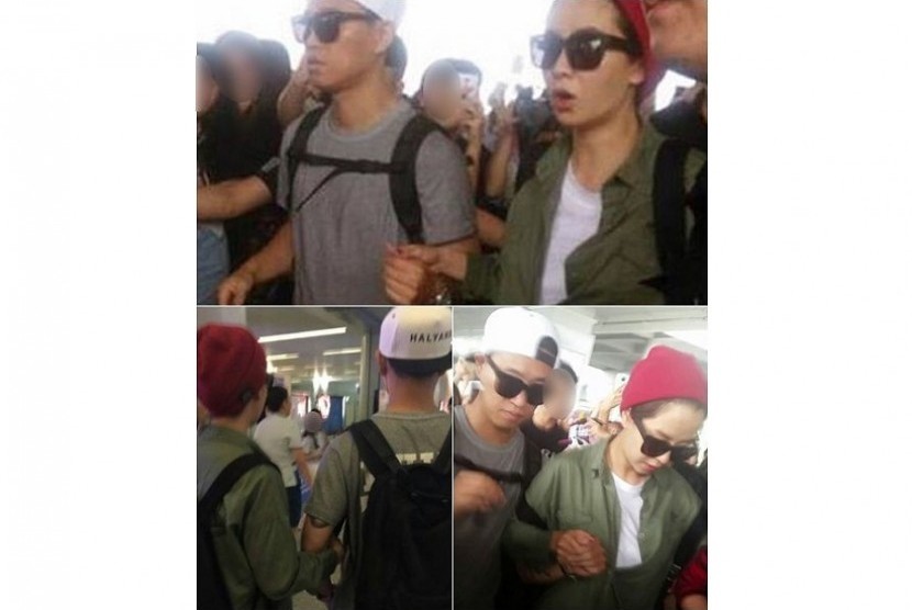 Gary dan Song Ji Hyo berpegangan tangang saat tiba di Bandara Cina