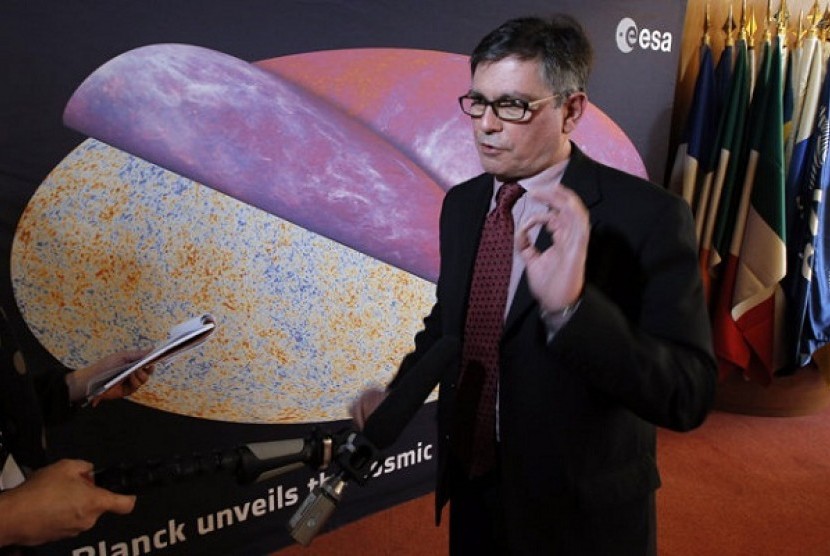 George Efstathiou, a European Space Agency astrophysicist speaks at ESA headquarters, in Paris, Thursday, March 21, 2013 in front of the most detailed map ever created of the cosmic microwave background acquired by ESA's Planck space telescope. 